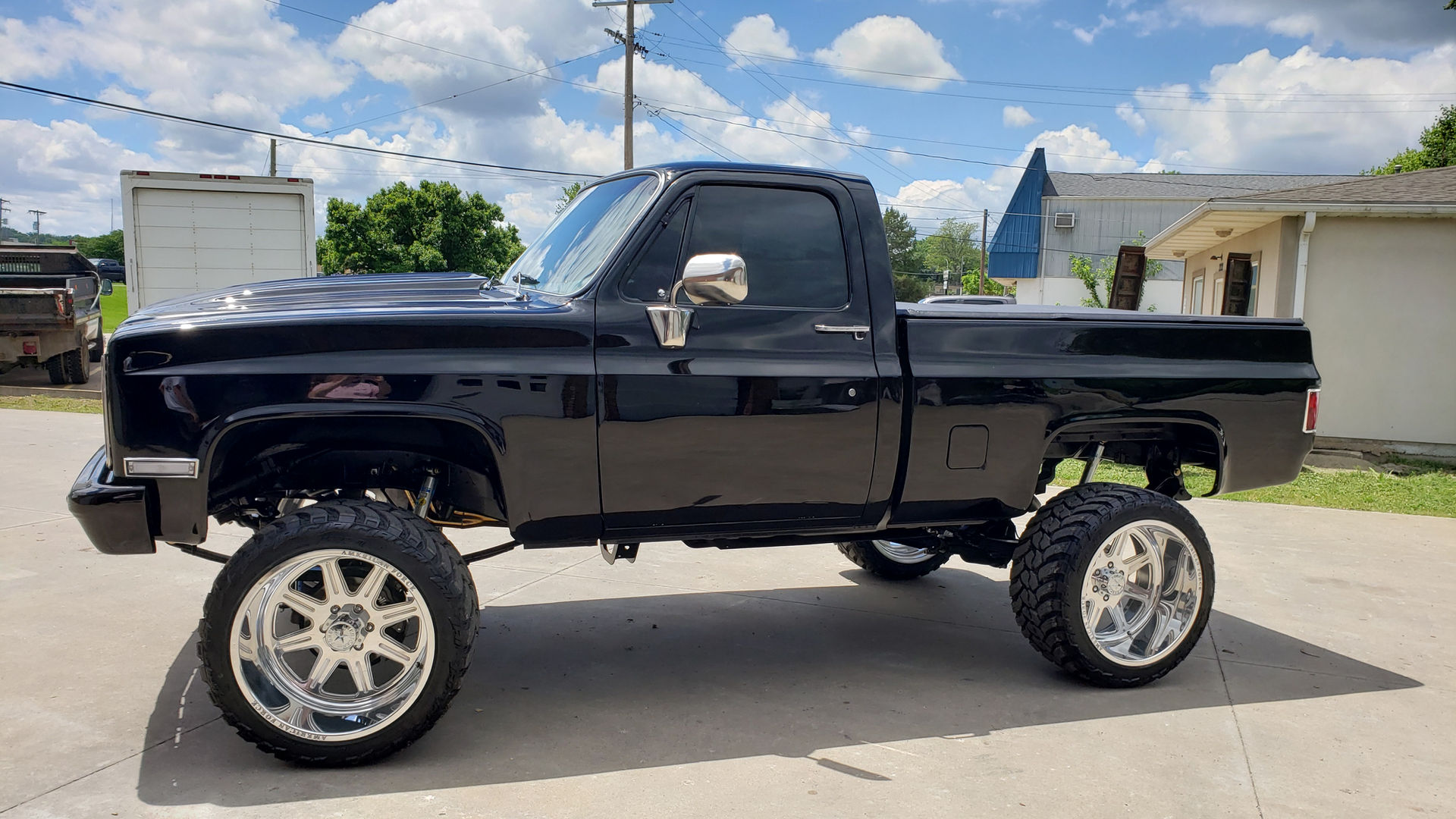 Black lifted classic Chevy truck