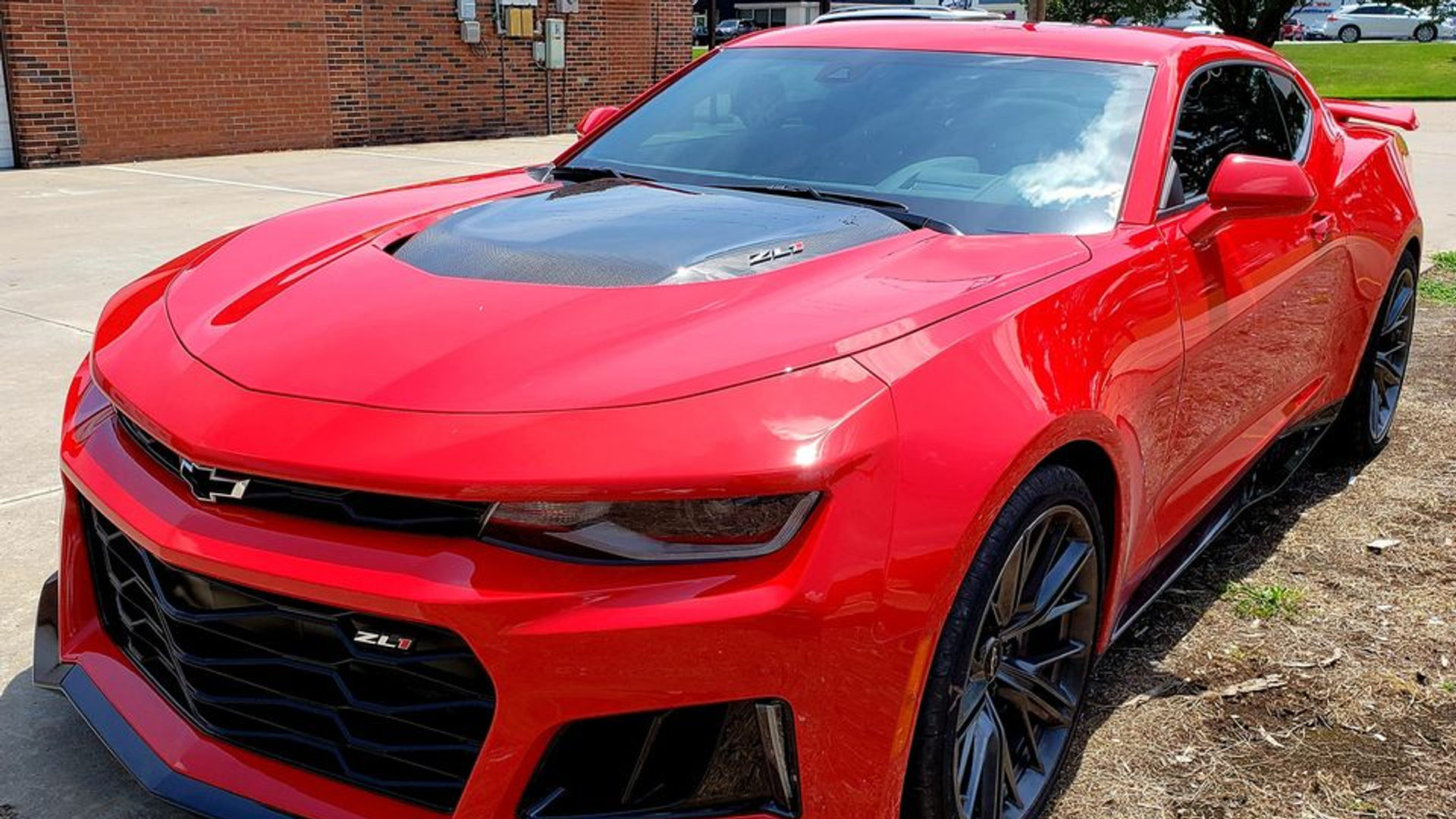 Red Camaro ZL1 with tinted windows