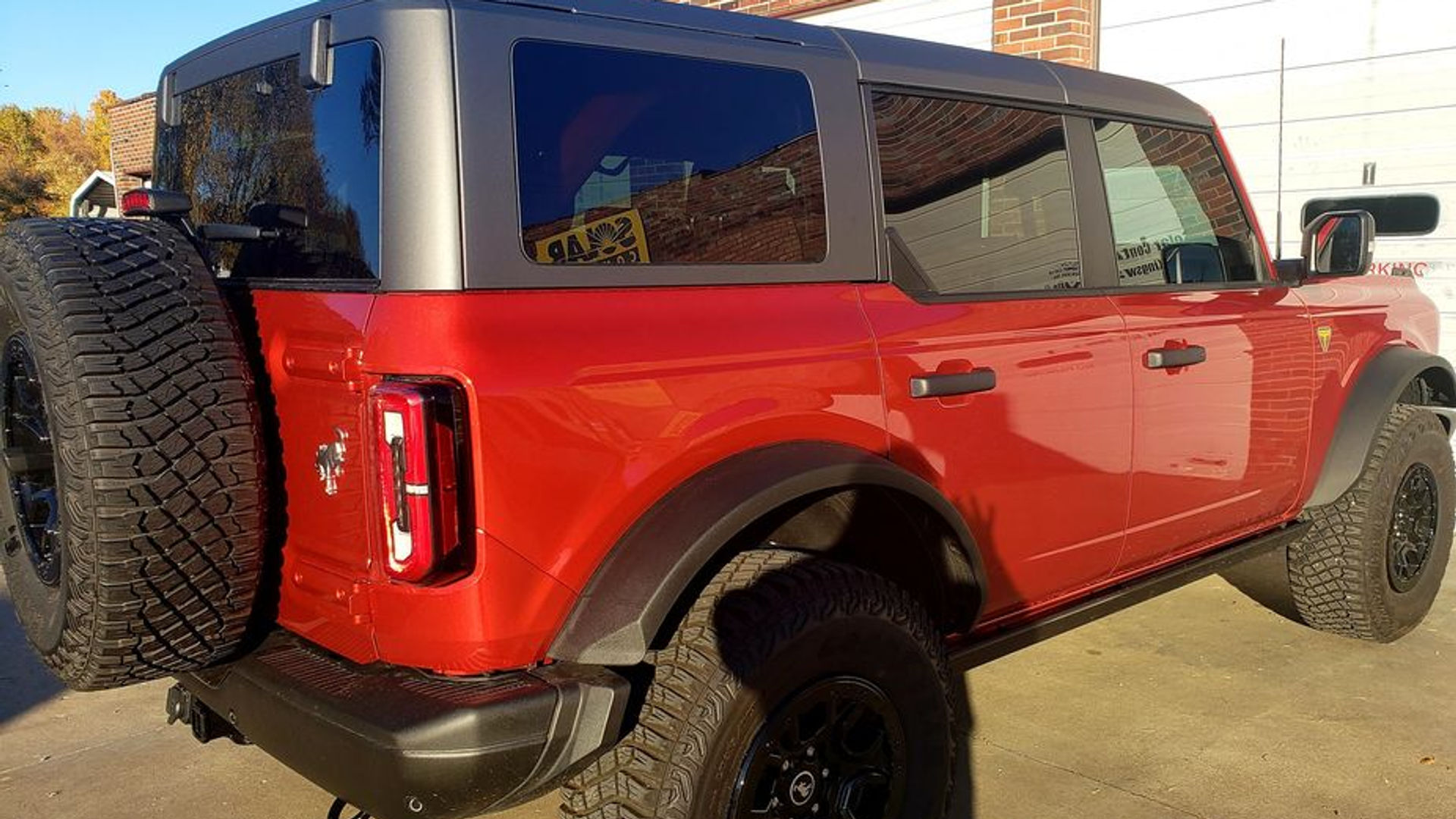 Red Ford Bronco 4-door with tinted windows