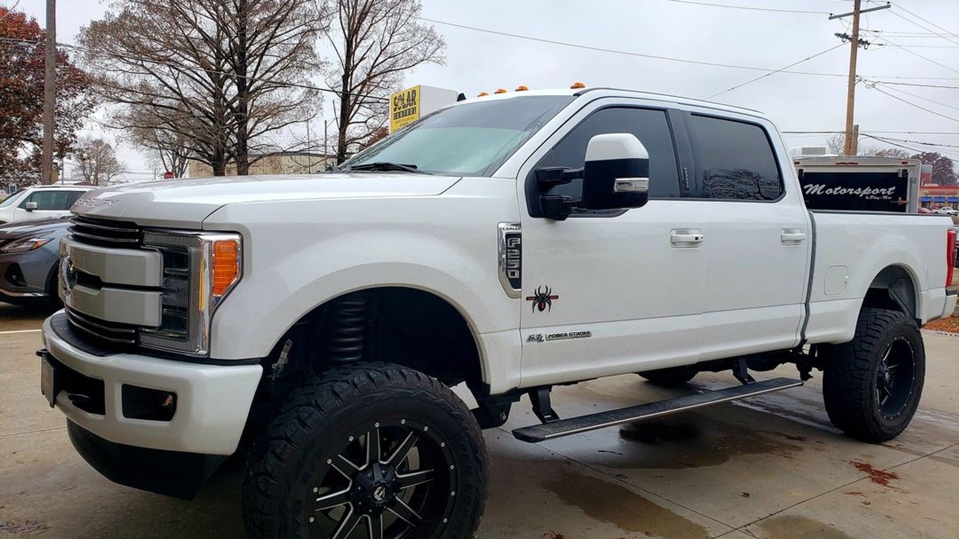 White lifted Ford F-250 Super Duty